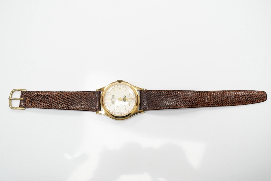 A gentleman's 1950's? steel and gold plated Oska Calendar Moonphase manual wind wrist watch, case diameter 32mm, on a later associated strap. Condition - poor to fair